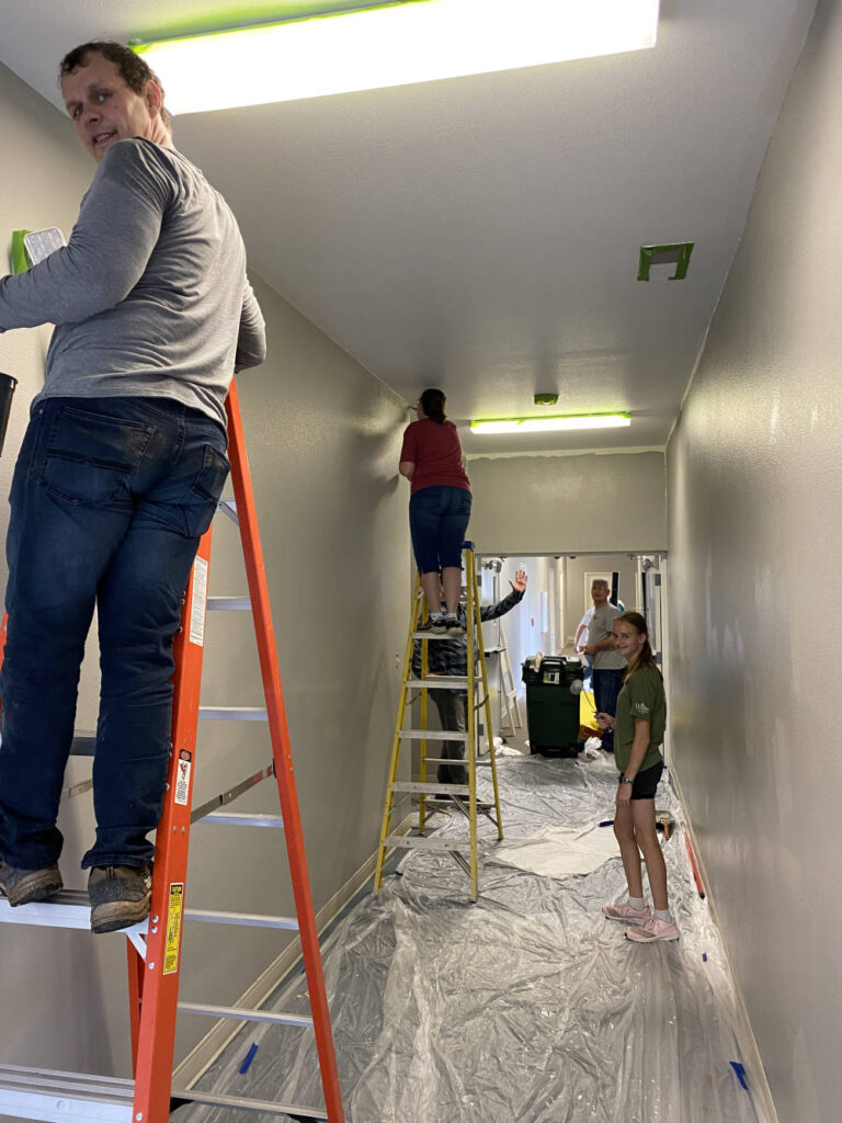 Our Linder Road paint crew is painting an inside hallway.